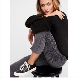 Free people dark wash denim embroidered jeans.